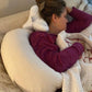 A customer using the neck-o pillow while taking a nap. This cervical pillow is great for getting proper sleeping posture